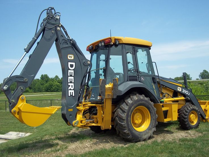 What are the Benefits of Owning a Garden Tractor with a Backhoe?