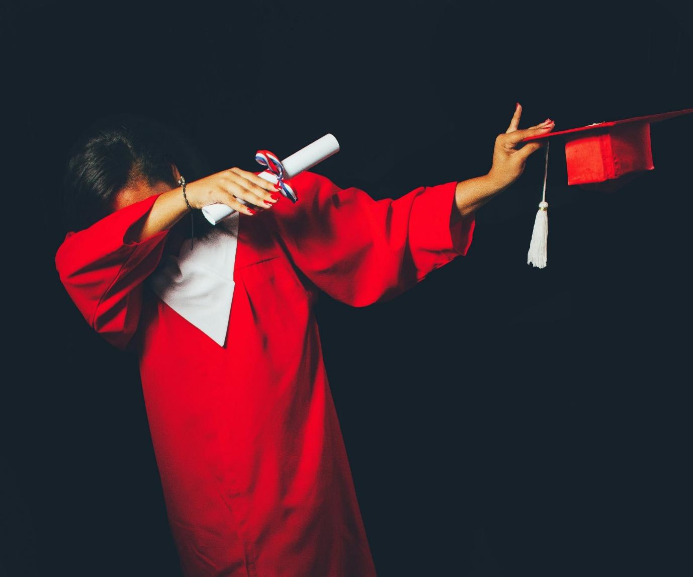 person wearing red graduation dress