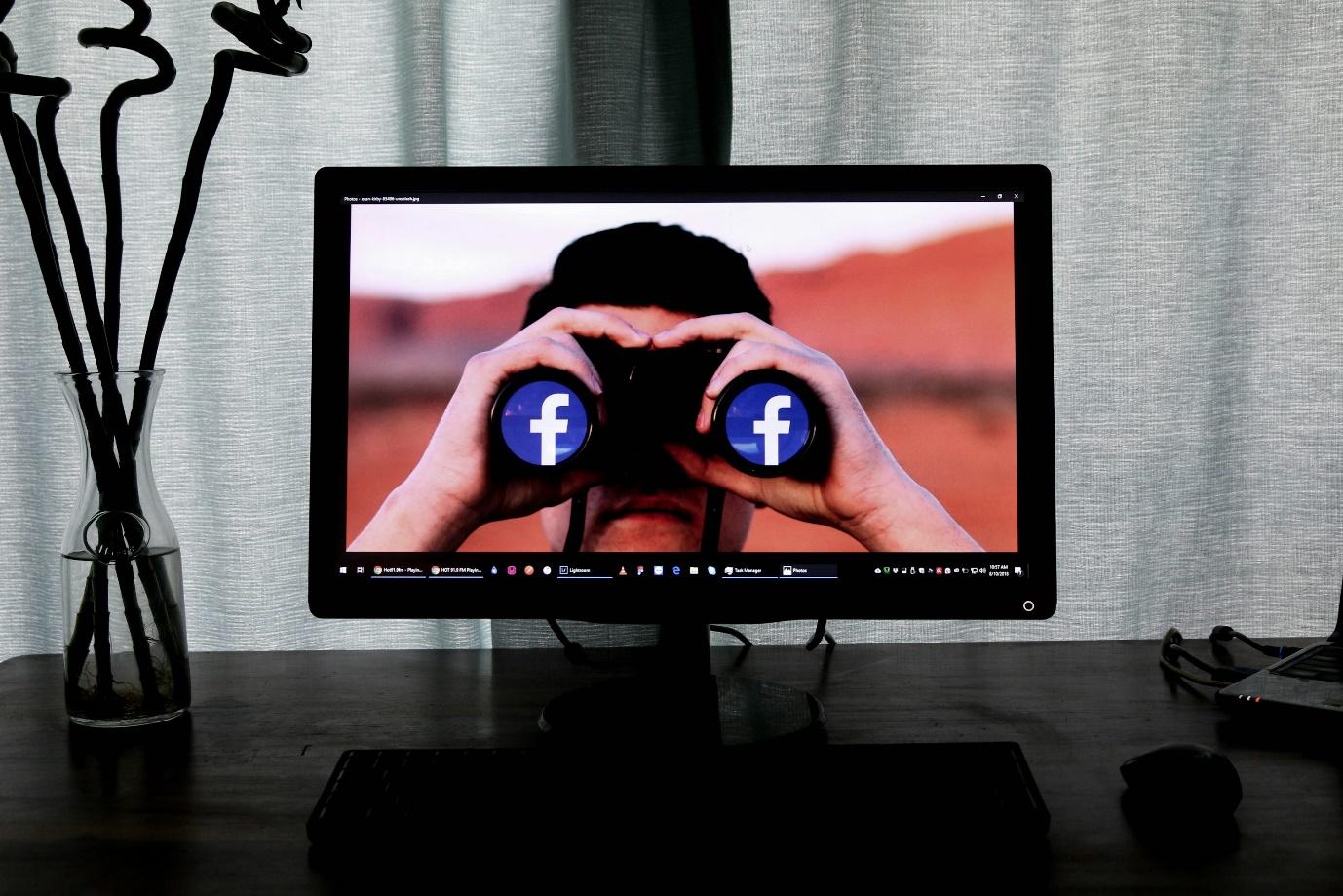 television showing man using binoculars