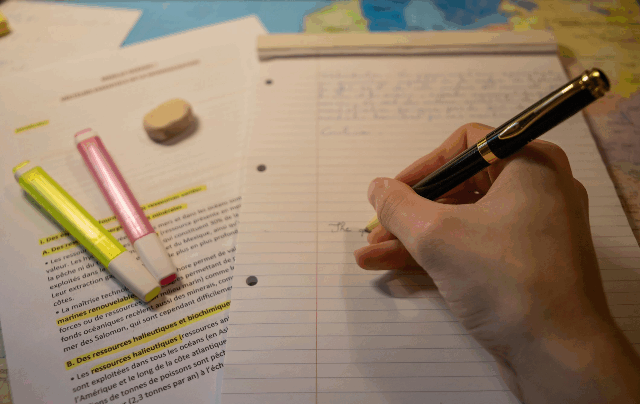 A person writing on a notebook